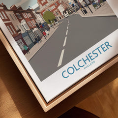 Colchester England city street wall art in natural wood floating frame, close-up view