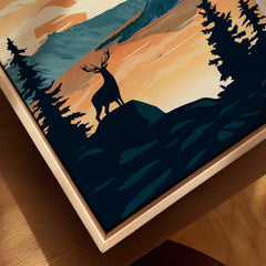 Closeup of framed canvas wall art with deer silhouette and sunset forest landscape