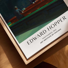 Edward Hopper Nighthawks 1942 Iconic Diner Art Print AIC Poster displayed in a wooden frame.