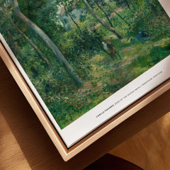 Exhibition Art Print Camille Pissarro Edge of the Woods Impressionist Landscape Poster Wall Art displayed in a wooden frame.
