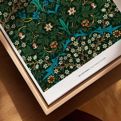 Exhibition Art Print William Morris Tulip Famous Pattern Arts Crafts Floral Poster Wall Art displayed on wooden table.