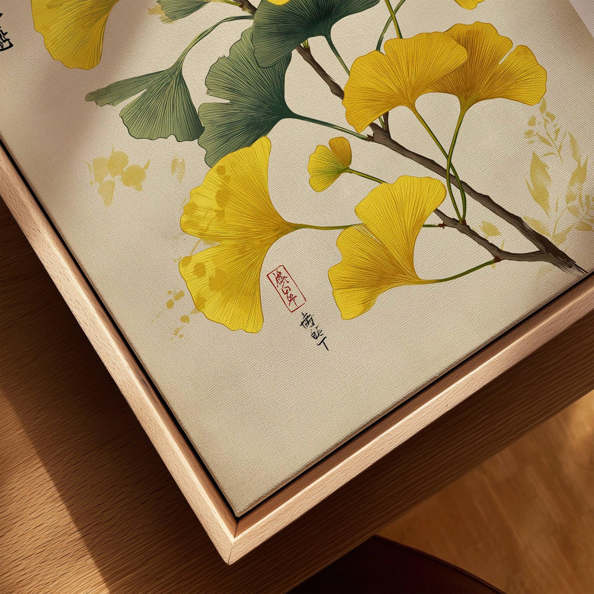Closeup of ginkgo leaf art print in natural wood floating frame, botanical wall decor