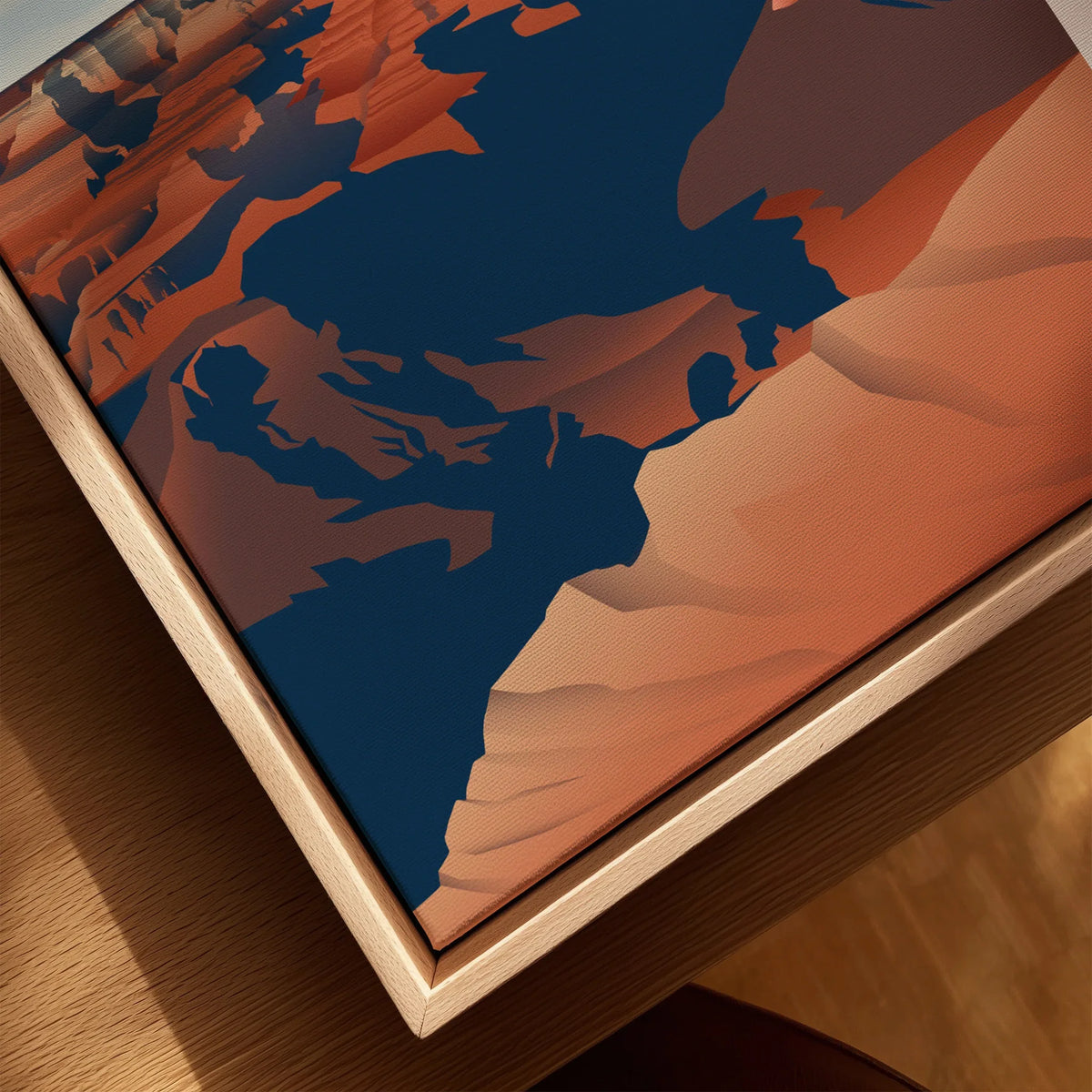 Close-up of a Grand Canyon art print in a natural wood floating frame