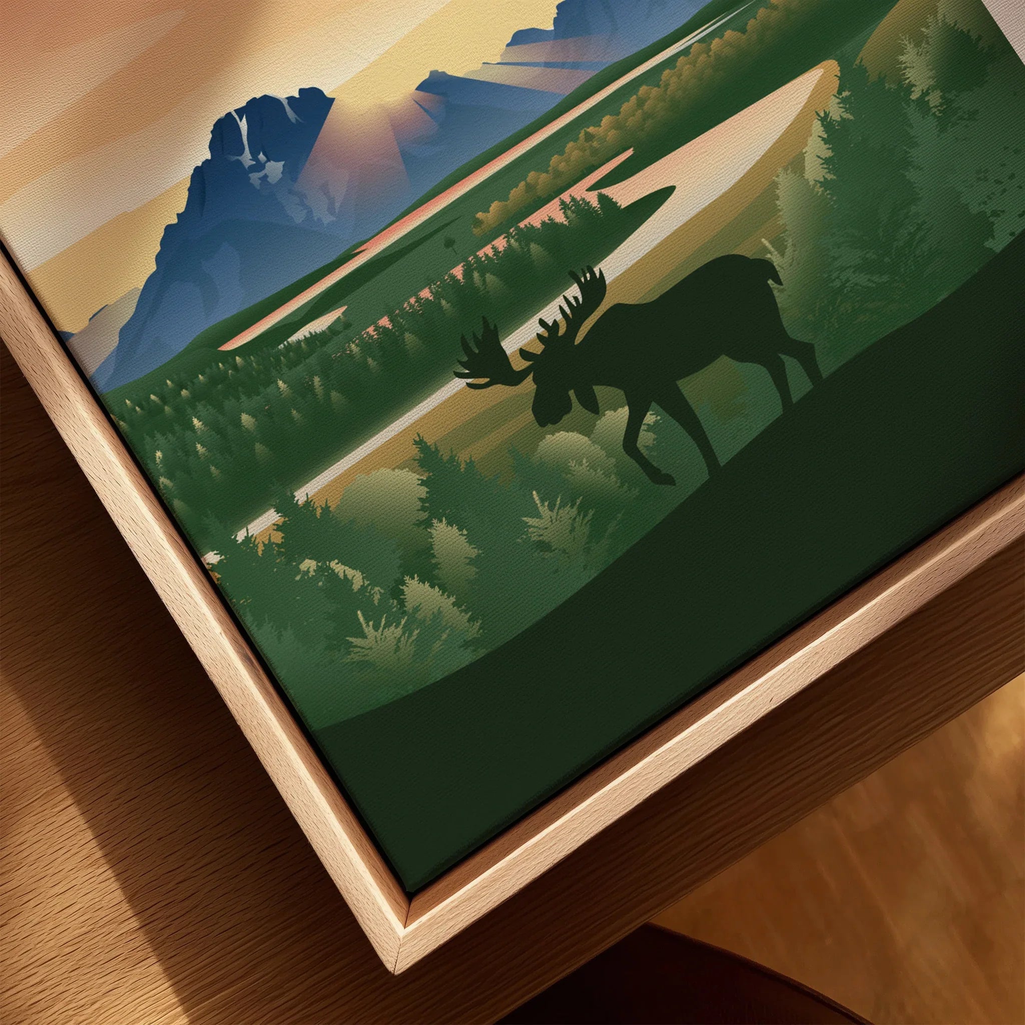 Framed canvas art with moose silhouette, pine trees, and Grand Teton mountains