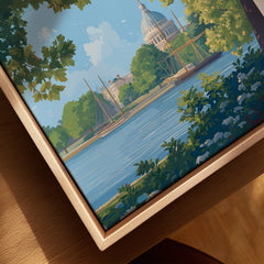 Closeup of framed canvas wall art featuring a city river scene with domed building and trees