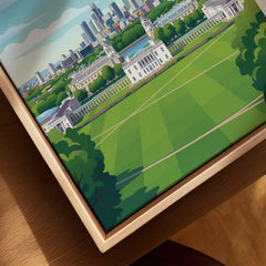 Closeup of framed canvas art with a cityscape and green park in a natural wood floating frame.