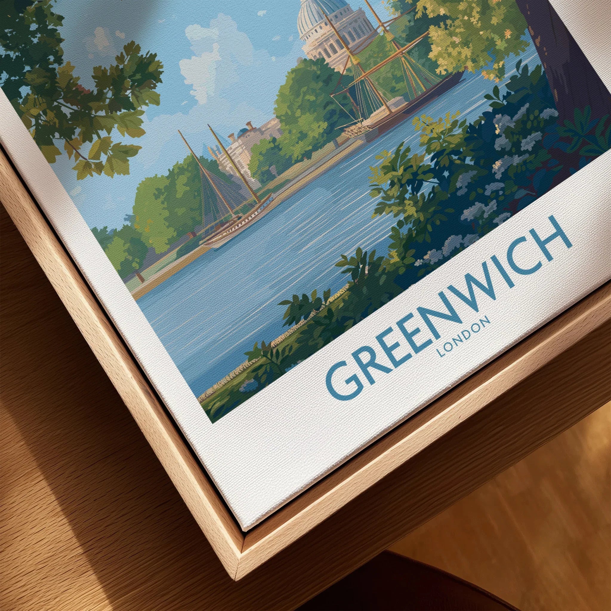 Greenwich London travel poster close-up in natural wood floating frame, featuring river and trees.