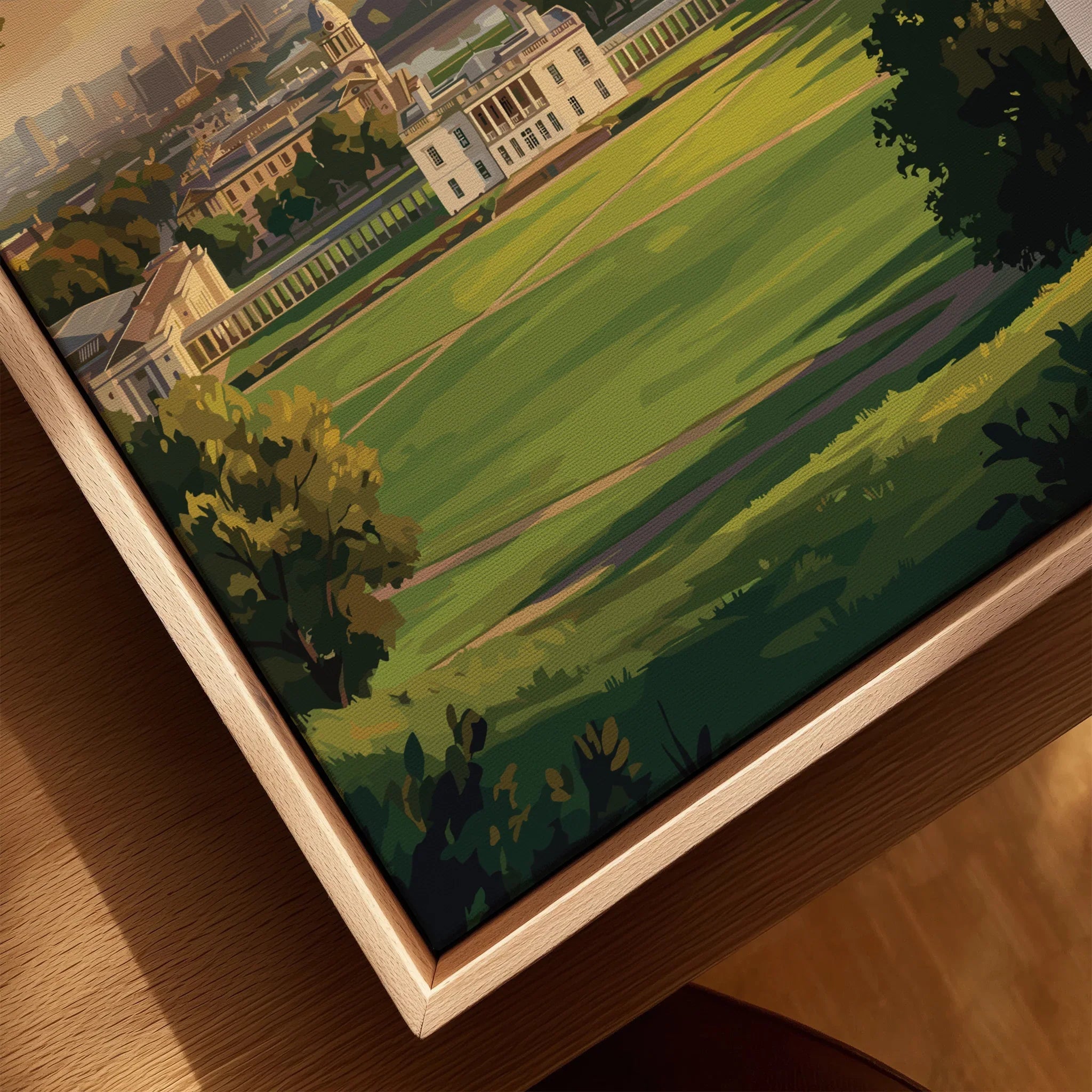 Close-up of a framed canvas travel poster with a natural wood floating frame, featuring a scenic city park illustration.