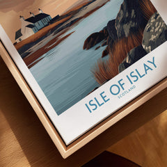 Isle of Islay Scotland Canvas Print | Hebrides Sunset Landscape Posters displayed on a wooden table with scenic coastal view.
