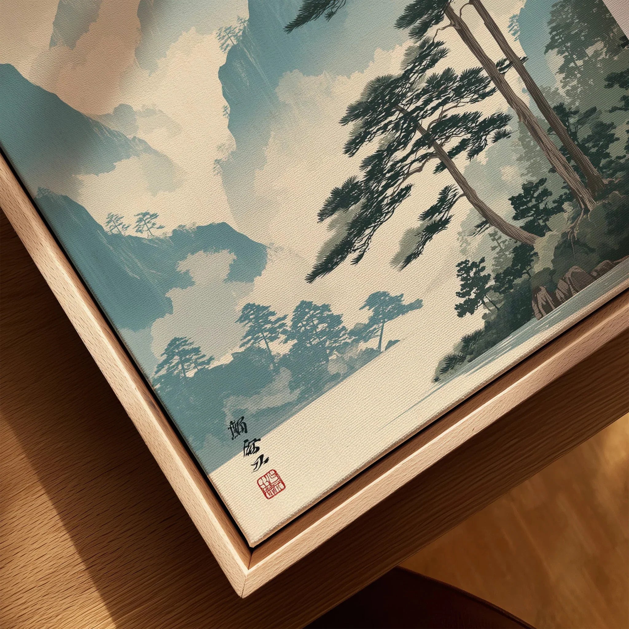 Close-up of framed canvas with Japanese woodblock style landscape and natural wood frame