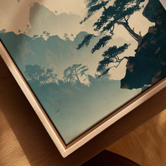 Close-up of a woodblock landscape art print with pine trees in a natural wood floating frame