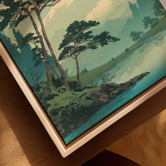 Close-up of framed canvas wall art with trees and lake in a natural wood frame