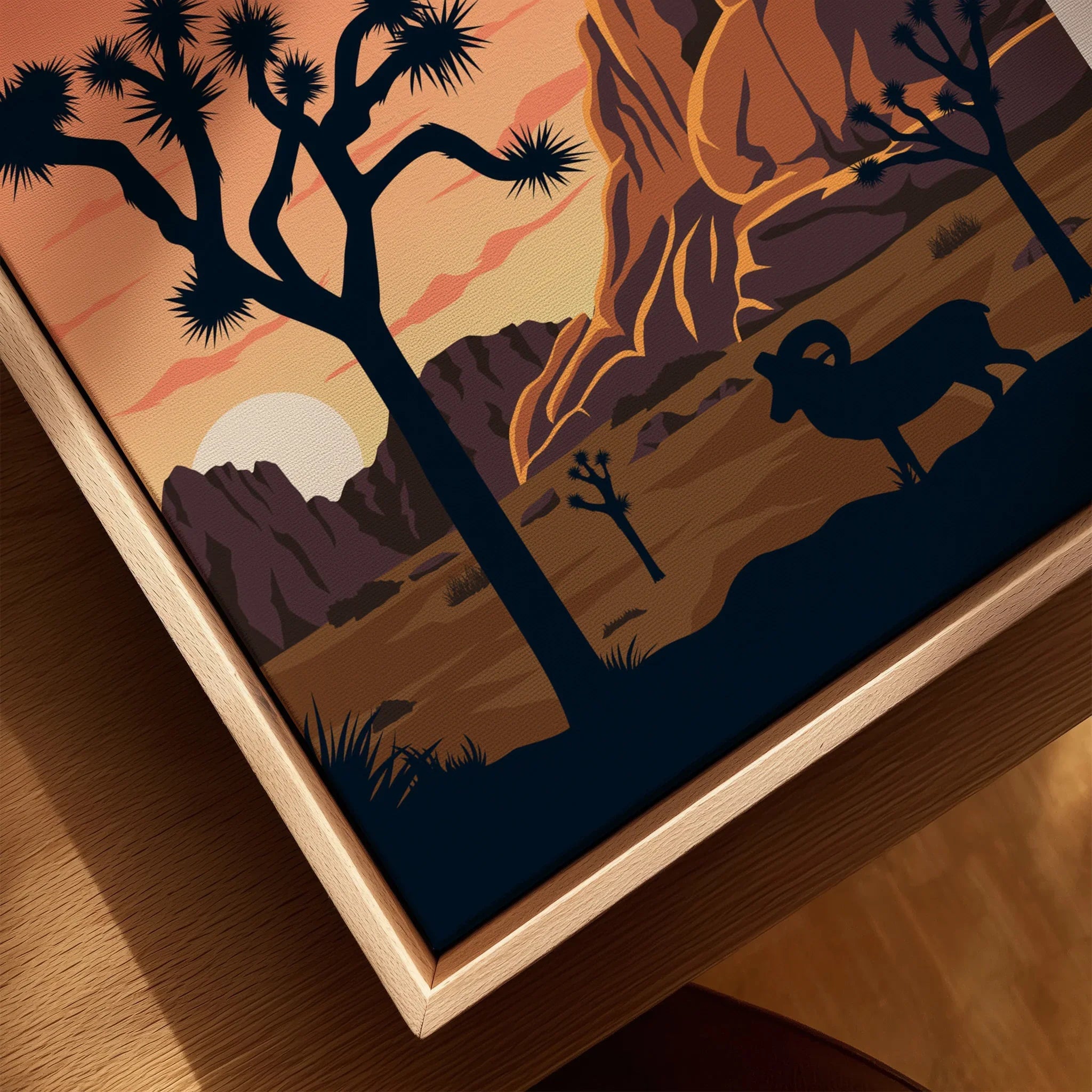 Closeup of framed Joshua Tree National Park print with ram and desert sunset scene