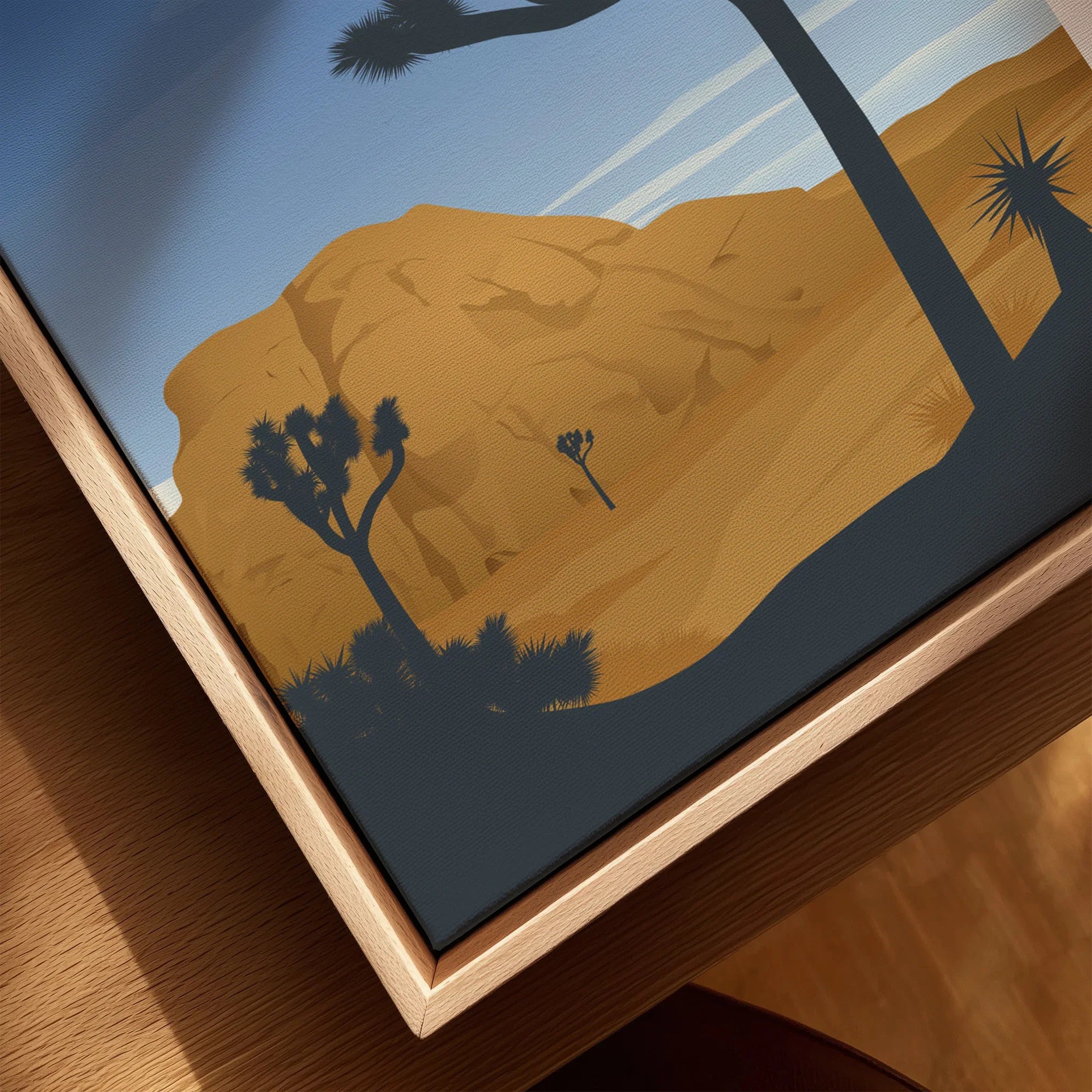Closeup of Joshua Tree National Park art print on canvas with natural wood floating frame