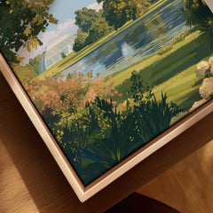 Close-up of framed canvas wall art with a scenic park landscape and glasshouse, natural wood frame.