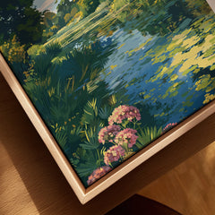 Close-up of a framed canvas wall art showing a colorful landscape with wildflowers, pond, and greenery in a natural wood floating frame.