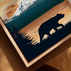 Closeup of framed canvas wall art featuring a bear silhouette, mountain sunset, and forest.