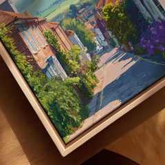 Close-up of a colorful framed city street art print in a natural wood floating frame