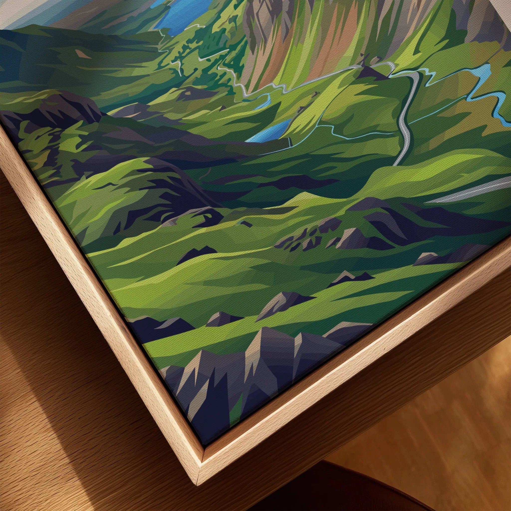 Close-up of a framed canvas print featuring a colorful mountain landscape wall art