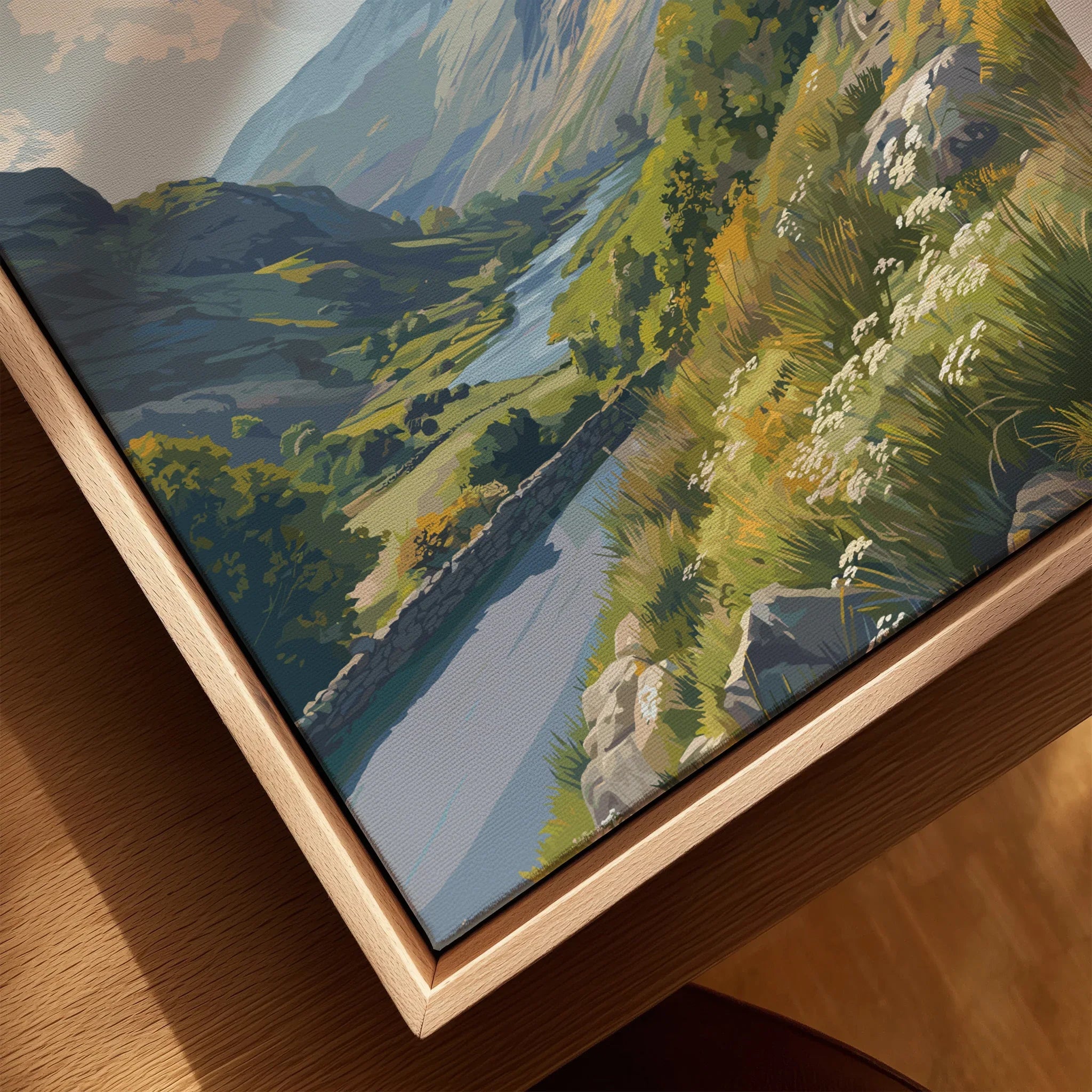 Closeup of framed canvas wall art with a scenic mountain landscape and river in a natural wood floating frame.