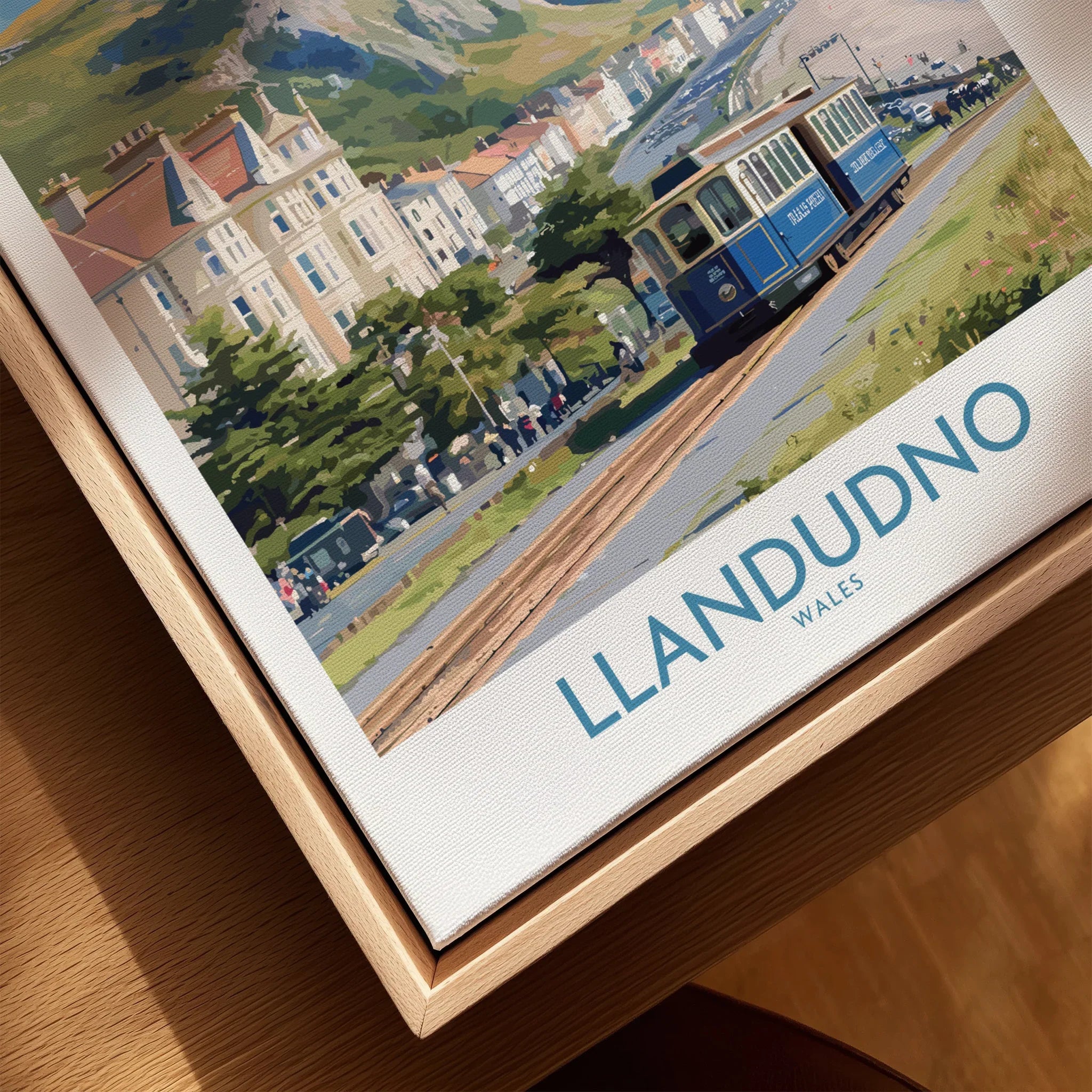 Framed canvas print of Llandudno Wales travel poster with vintage tram and seaside scene