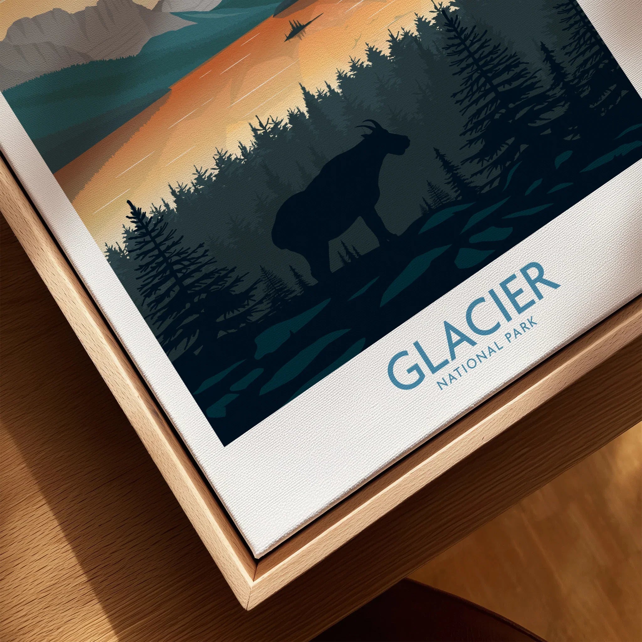 Closeup of Glacier National Park wall art with mountain goat silhouette in wood floating frame