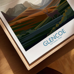 Closeup of Glencoe National Park travel poster framed in natural wood, featuring scenic mountains and deer.