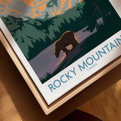 Rocky Mountain Canada framed wall art featuring a bear, forest, and mountains at sunset