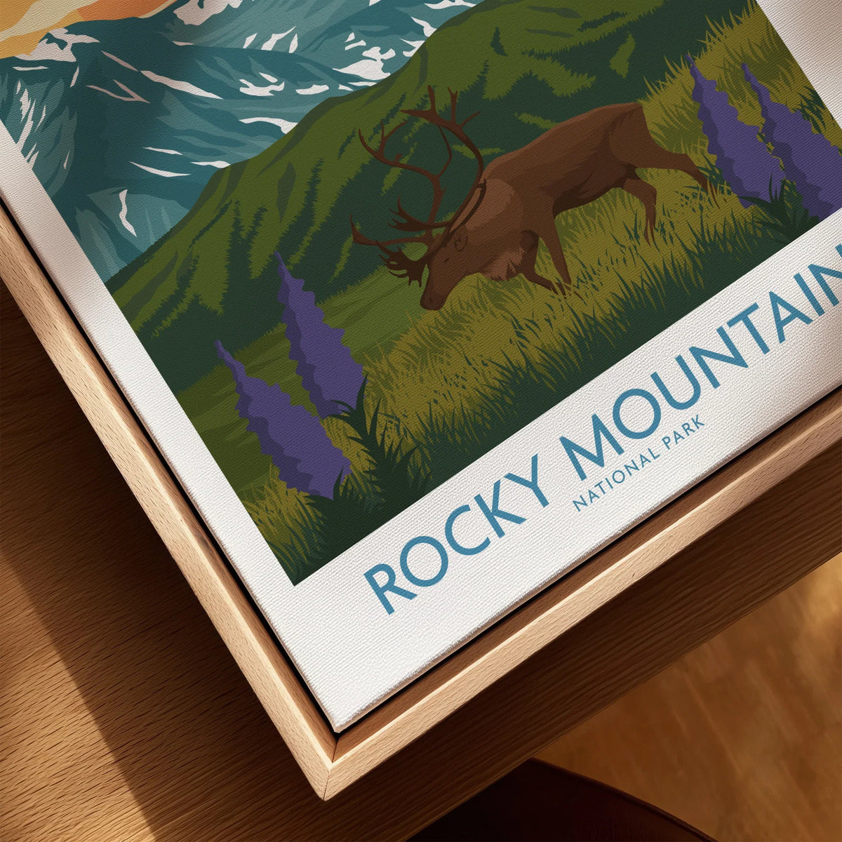 Framed Rocky Mountain National Park canvas print featuring elk, wildflowers, and mountains.