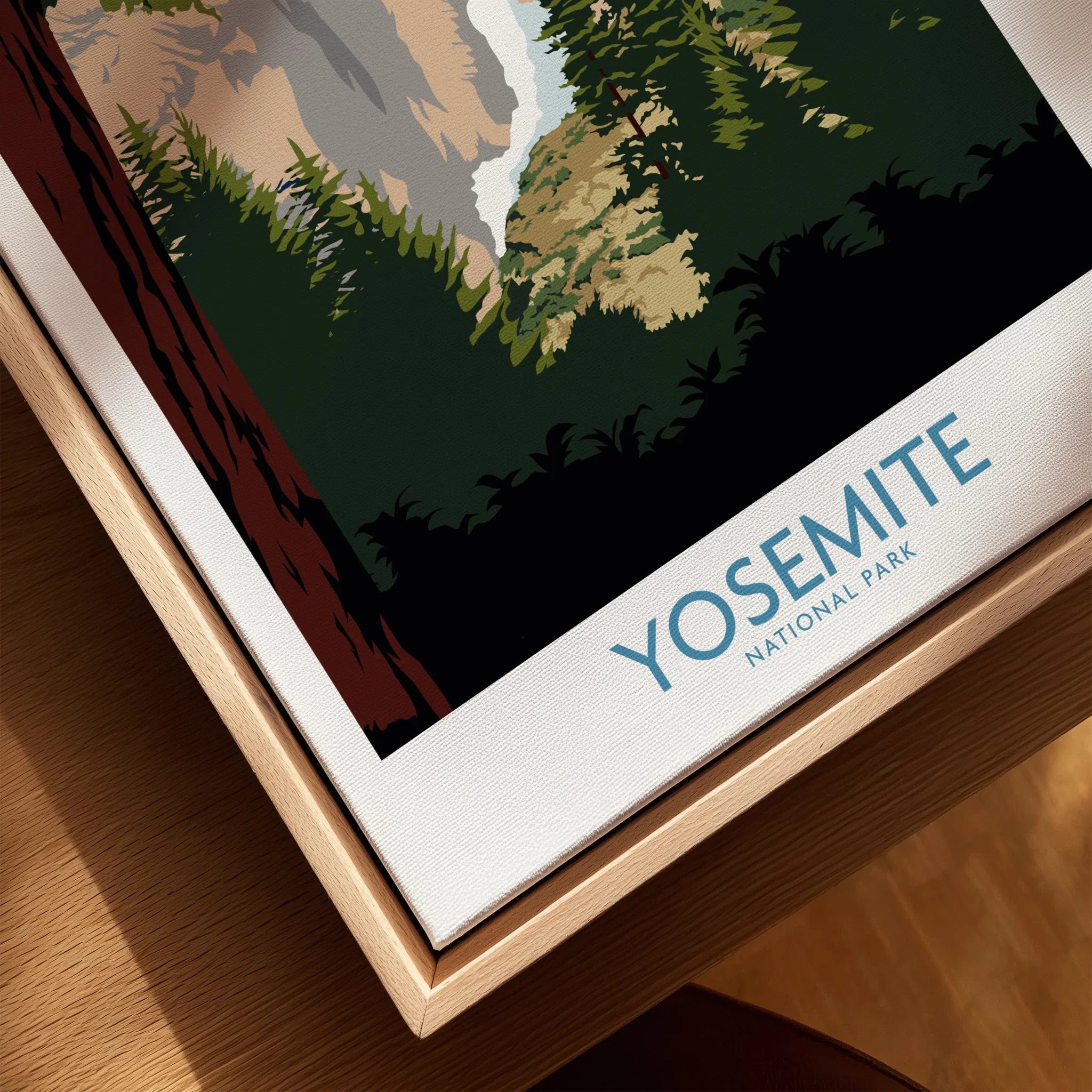 Closeup of Yosemite National Park travel poster in natural wood floating frame