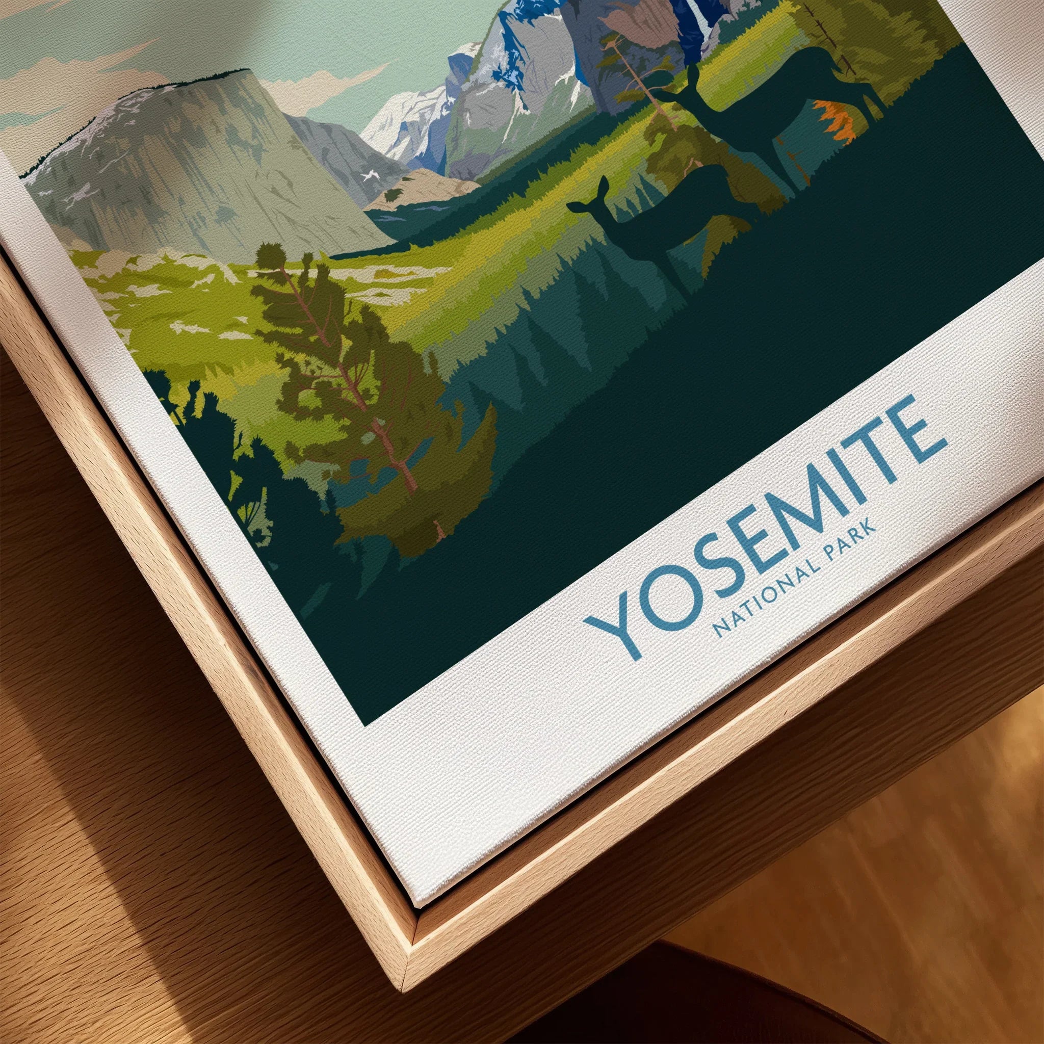 Closeup of framed Yosemite National Park canvas print featuring scenic landscape and deer