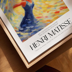 Matisse Art Prints - Dancing Figure Swirl Background Art Print displayed in a wooden frame with vibrant colors.
