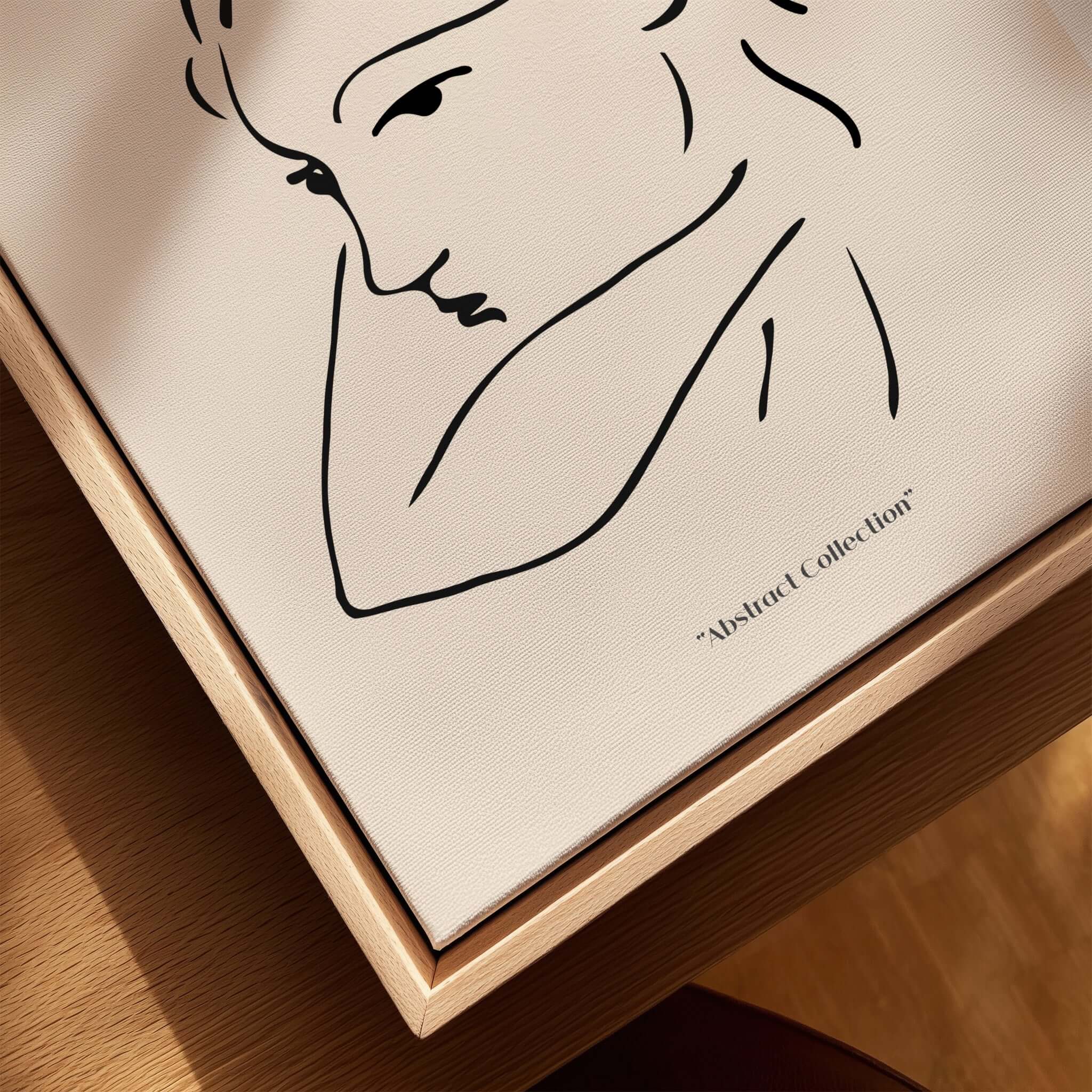 Matisse Art Prints - Abstract Line Drawing of Lady displayed in a wooden frame against a beige background.