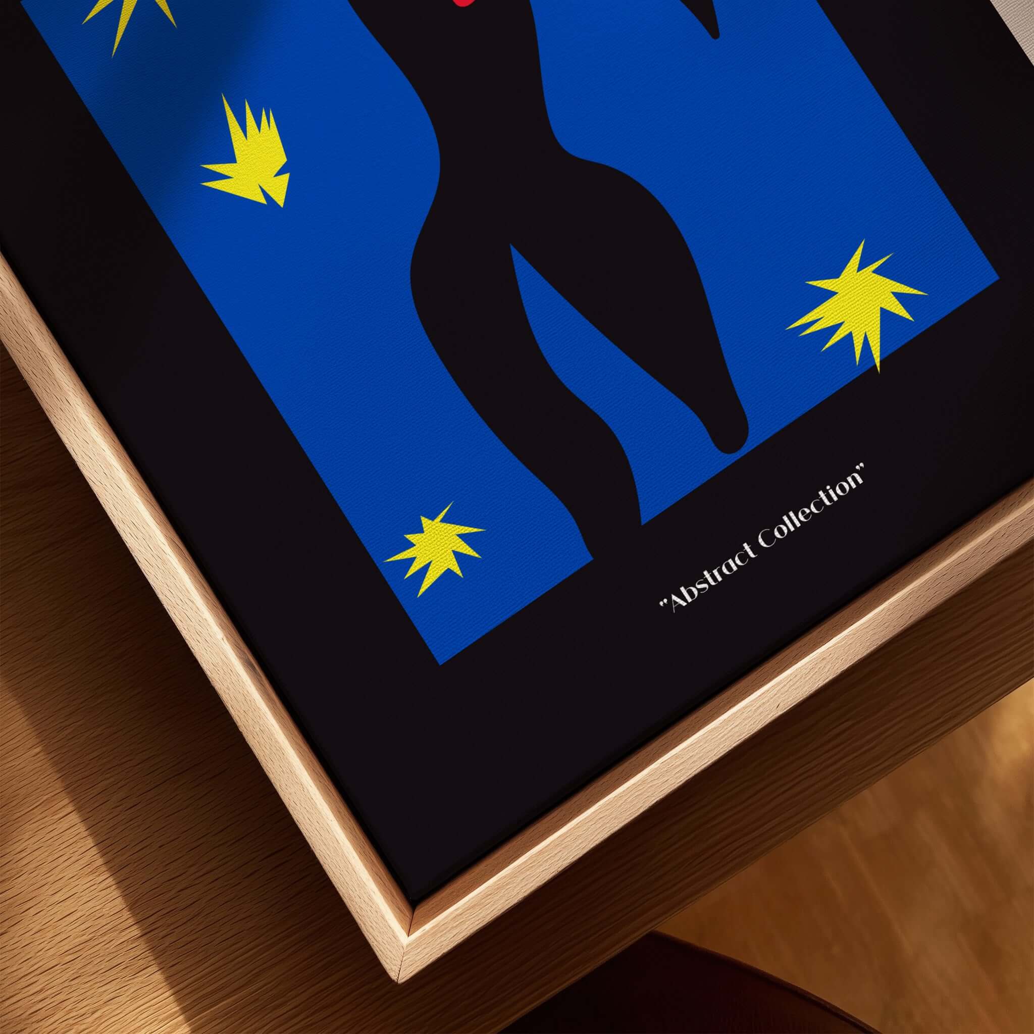 Matisse Art Prints - Icarus Black Figure with Stars Poster displayed in a wooden frame with abstract elements.