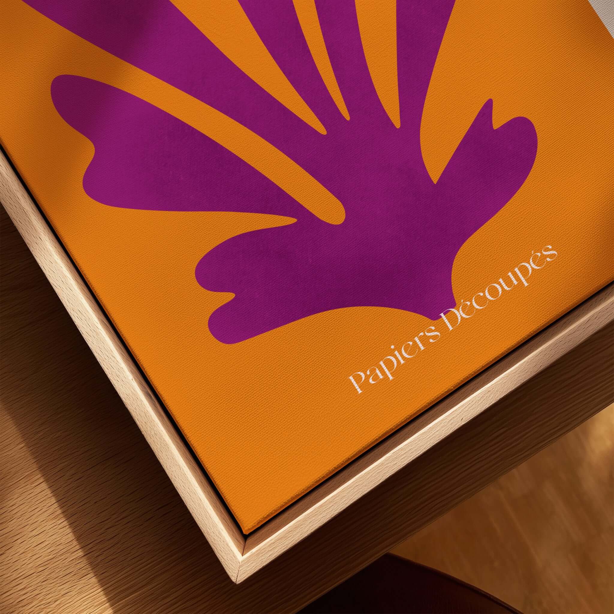 Matisse Papiers Découpés Purple Cut Out on Orange Background Abstract Art Print displayed on a wooden surface.