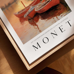Claude Monet Art Print - Red Boats at Sunset Riverbank Wall Art featuring vibrant red boats and sunset reflections.