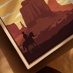 Framed canvas wall art of Monument Valley with cowboy silhouette and natural wood frame