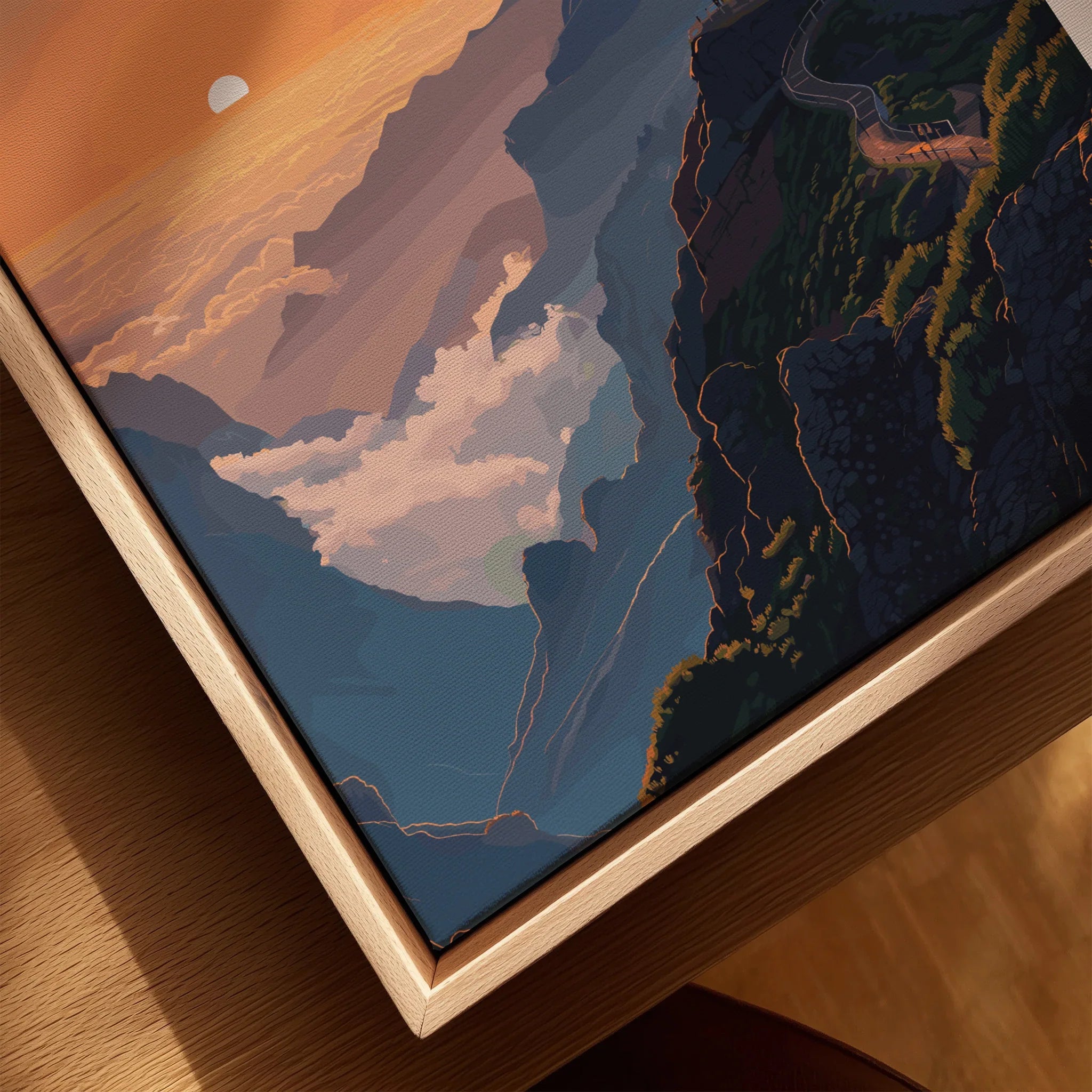 Closeup of framed canvas wall art with mountain landscape at sunset in natural wood floating frame