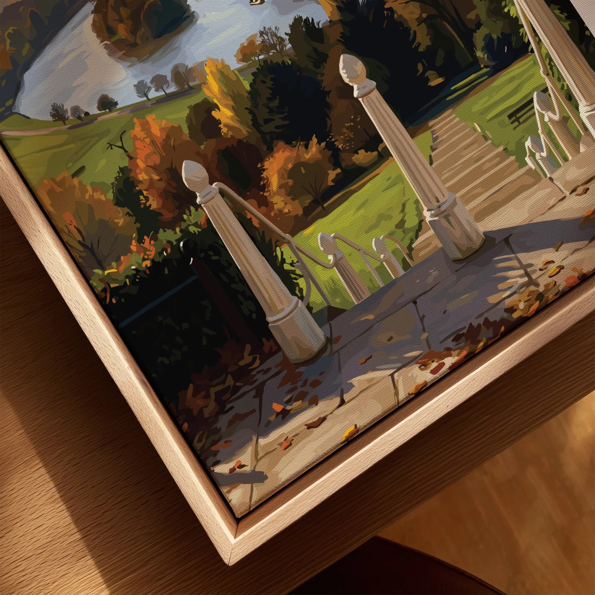 Closeup of framed canvas wall art with autumn landscape and stone staircase in natural wood frame