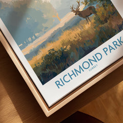 Richmond Park travel poster print with stag, displayed in a natural wood floating frame
