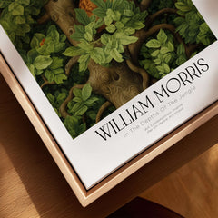 William Morris Ginger Cat in Tree Botanical Art Print - Foliage Poster displayed in a wooden frame with intricate foliage design.