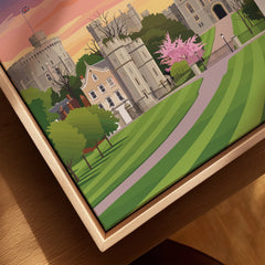 Close-up of a framed canvas print featuring a colorful Windsor castle landscape illustration.