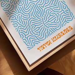 Yayoi Kusama Blue Infinity Net Pattern Abstract Art Print Paris Exhibition Poster displayed in a wooden frame.