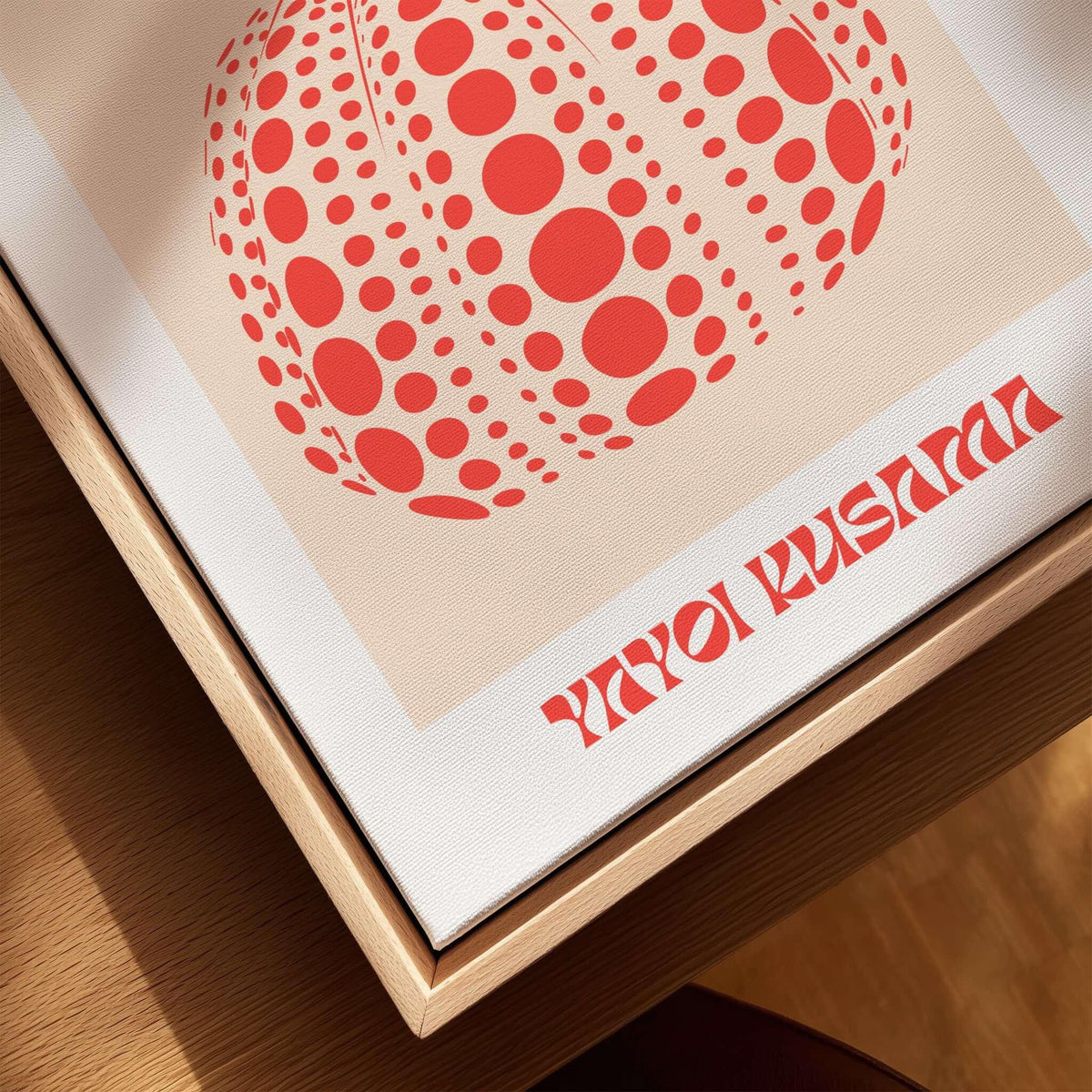 Yayoi Kusama Red Pumpkin Polka Dot Pop Art Print Poster Paris Exhibition Wall Art displayed on a wooden surface.