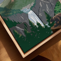 Framed canvas print of Yellowstone waterfall landscape with bear and pine trees, close-up view