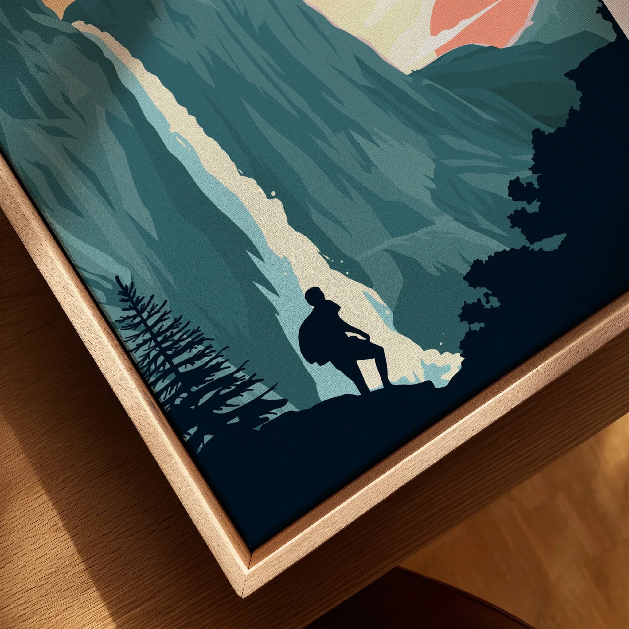 Closeup of a framed canvas with a stylized hiker silhouette by a waterfall in nature
