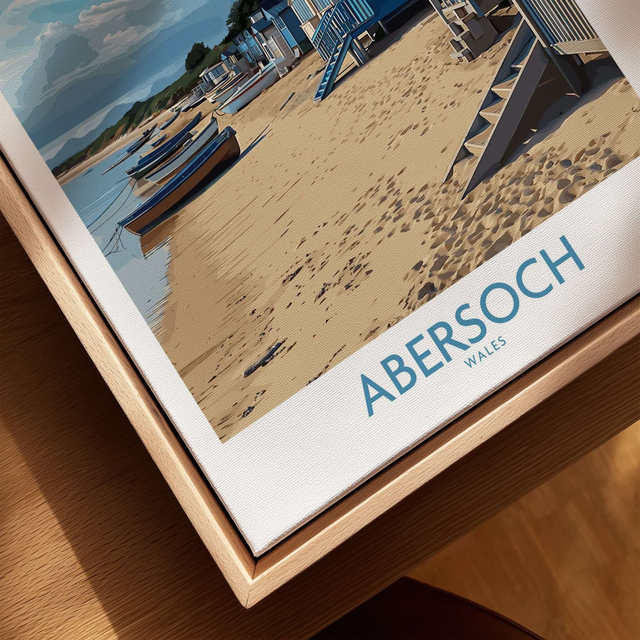Abersoch Wales Beach Huts Art Print | Coastal Boats Wall Decor Poster featuring colorful beach huts and boats on sandy shore.