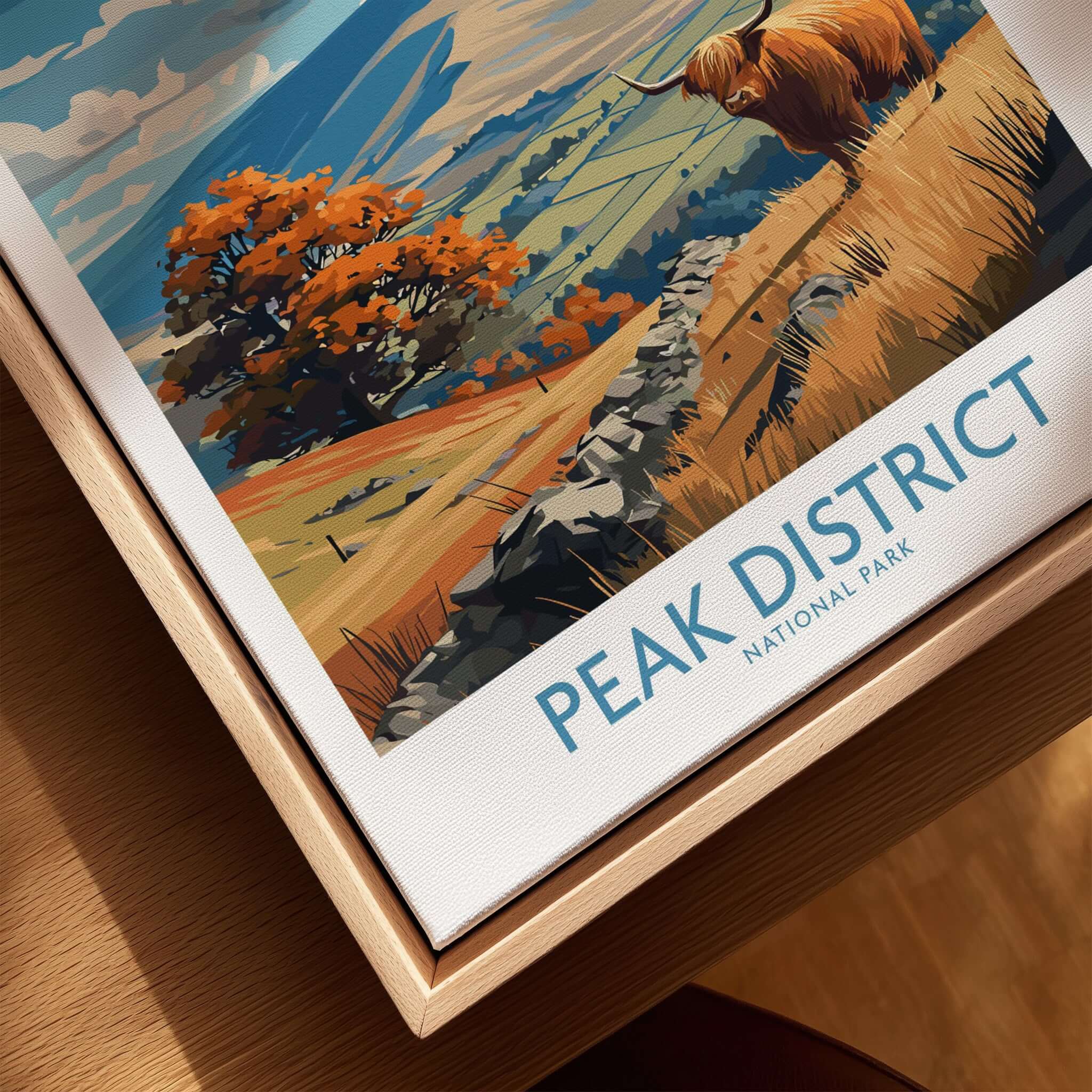 Peak District National Park Highland Cow Art Print | Derbyshire Landscape Poster framed in a wooden holder.
