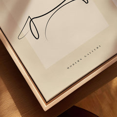 Picasso Dachshund Dog Line Art Minimalist Animal Poster Modern Gallery Print displayed in elegant wooden frame.