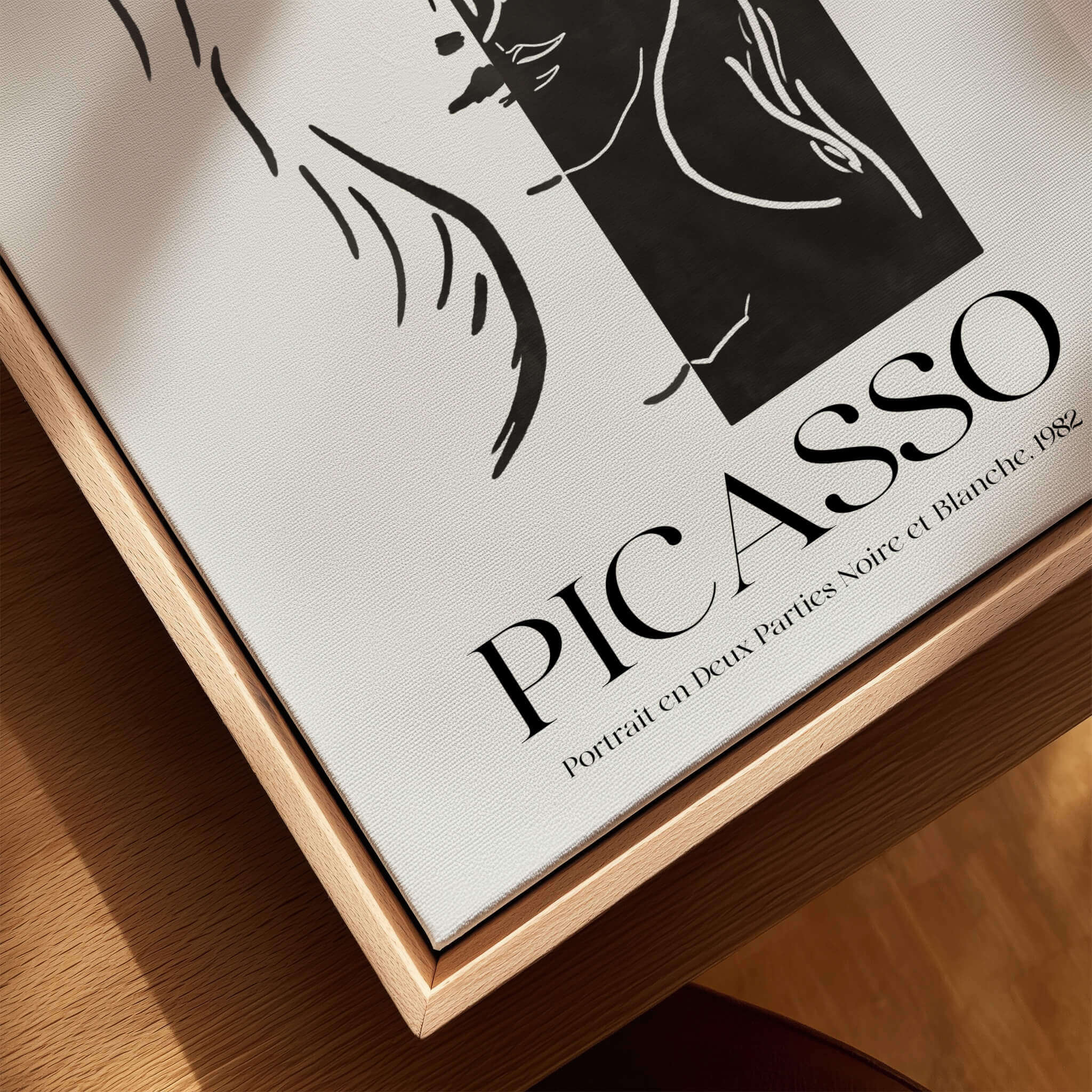 Picasso Portrait Deux Parties Black White Split Face Art Print Poster displayed on a wooden surface with title and year.